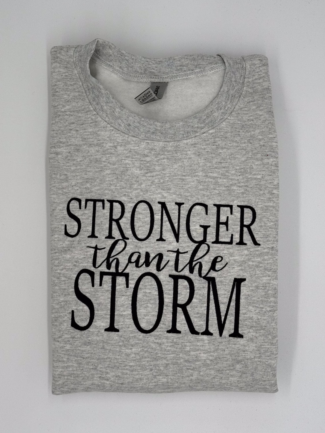 "Stronger Than The Storm" Embroidered Sweatshirt - GOdCREATEd