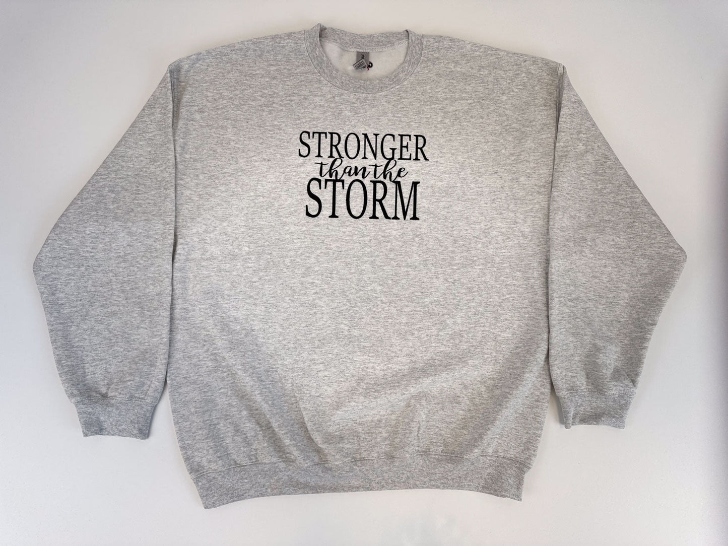 "Stronger Than The Storm" Embroidered Sweatshirt - GOdCREATEd