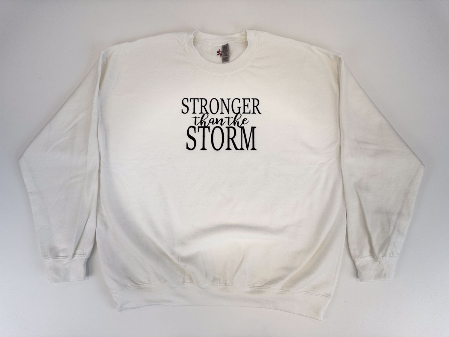 "Stronger Than The Storm" Embroidered Sweatshirt - GOdCREATEd