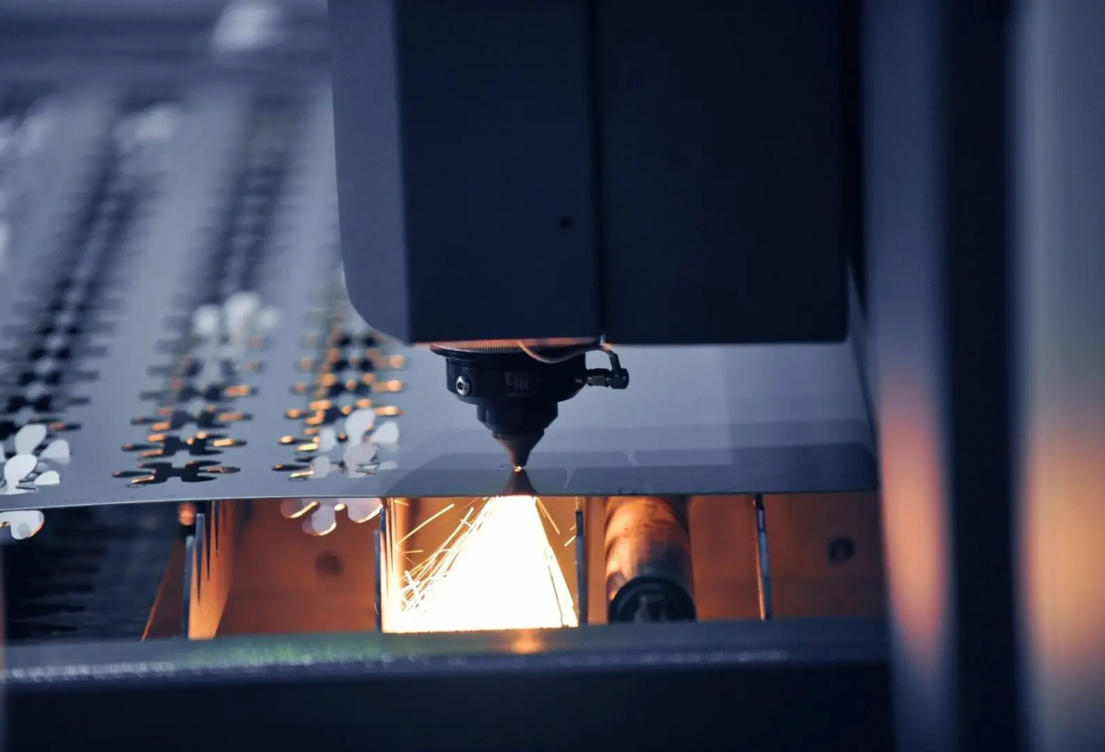 A machine is cutting metal with a flame.